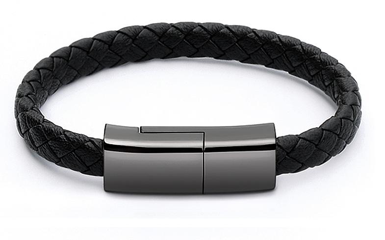 Black braided bracelet laid flat with its connector clasp